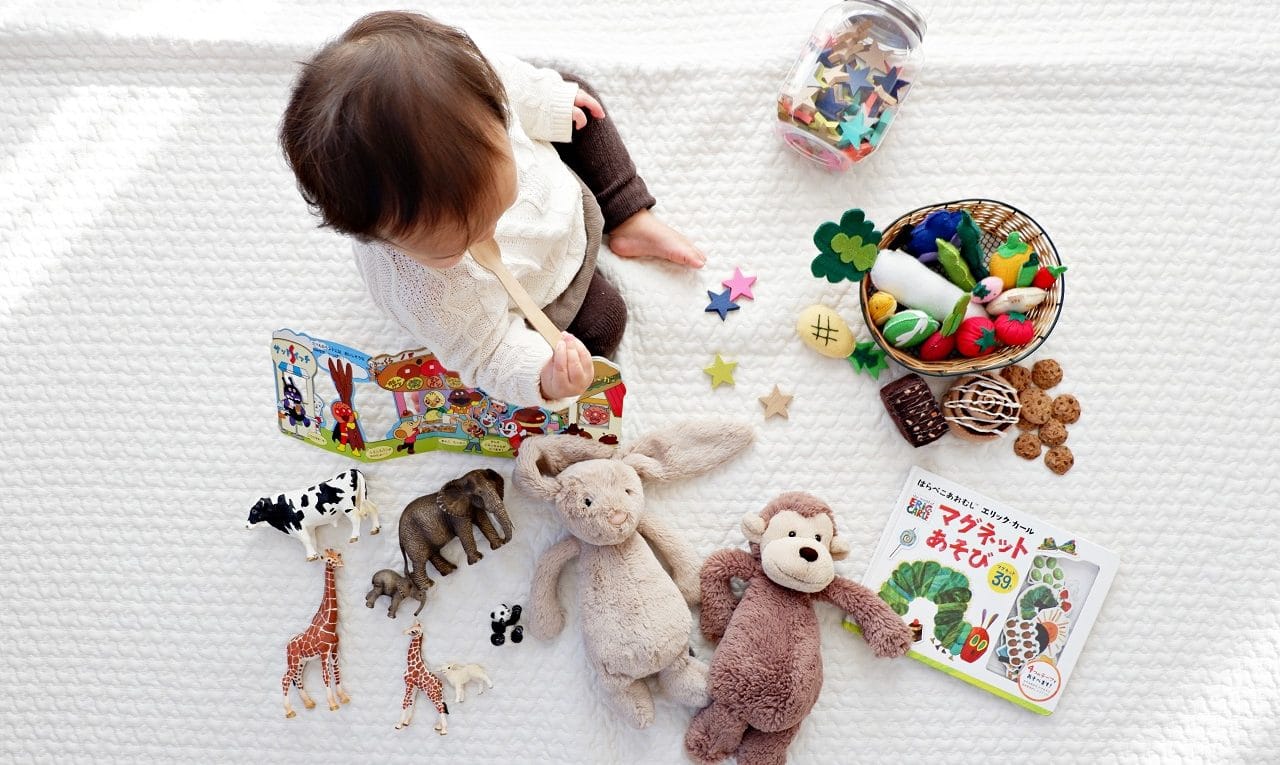 toddler playing with educational toys